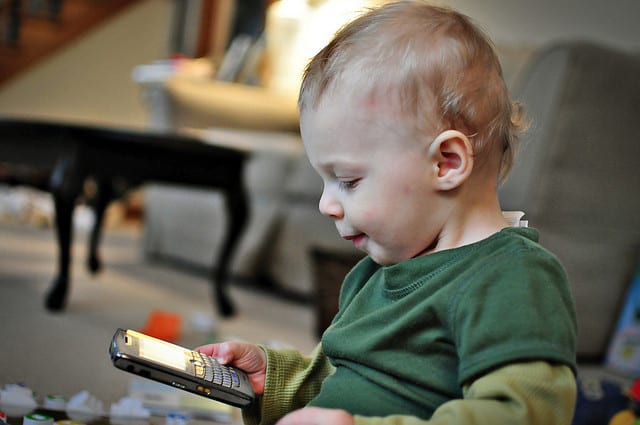 Baby checking email on his phone